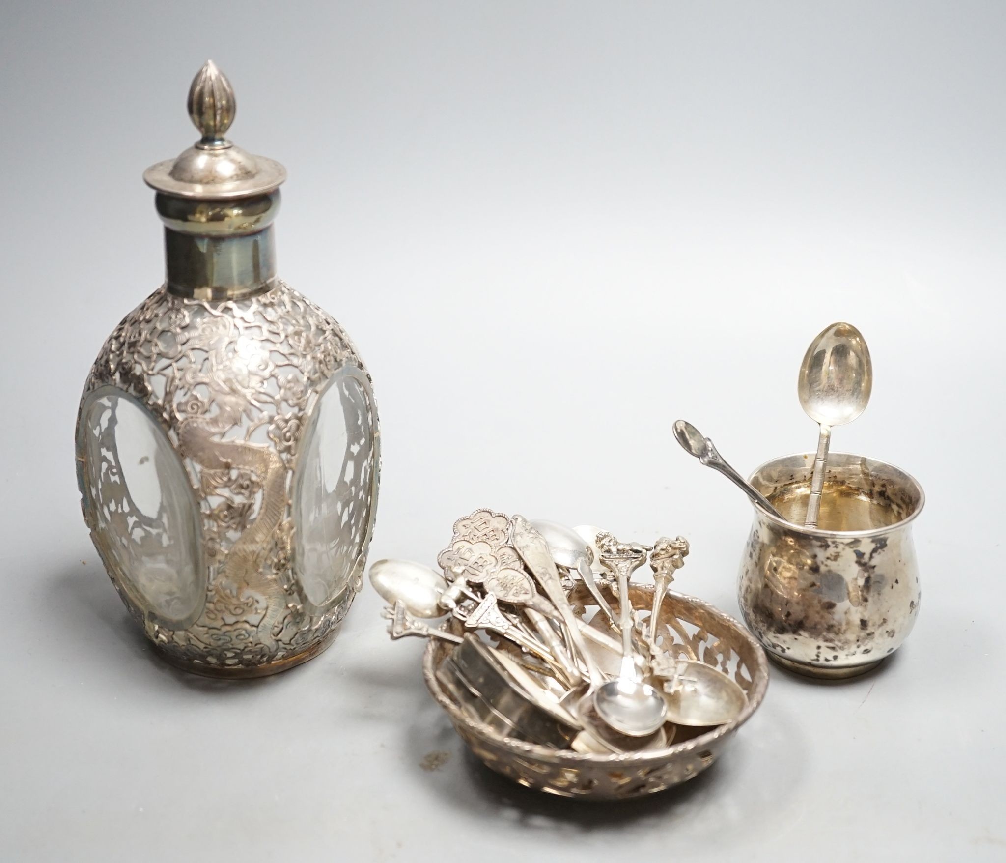 A Chinese white metal overlaid glass dimpled decanter and stopper, 19.1cm, a 900 small vase, a pierced silver bowl and a group of assorted Chinese and other white metal spoons.